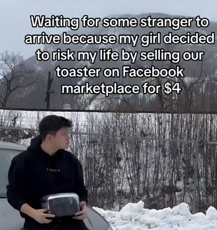 A Waiting meme showing a man standing outside in the snow, holding a toaster and looking around cautiously. The text above reads, "Waiting for some stranger to arrive because my girl decided to risk my life by selling our toaster on Facebook marketplace for $4," humorously conveying the anxiety and apprehension of waiting for a buyer in a potentially sketchy situation.