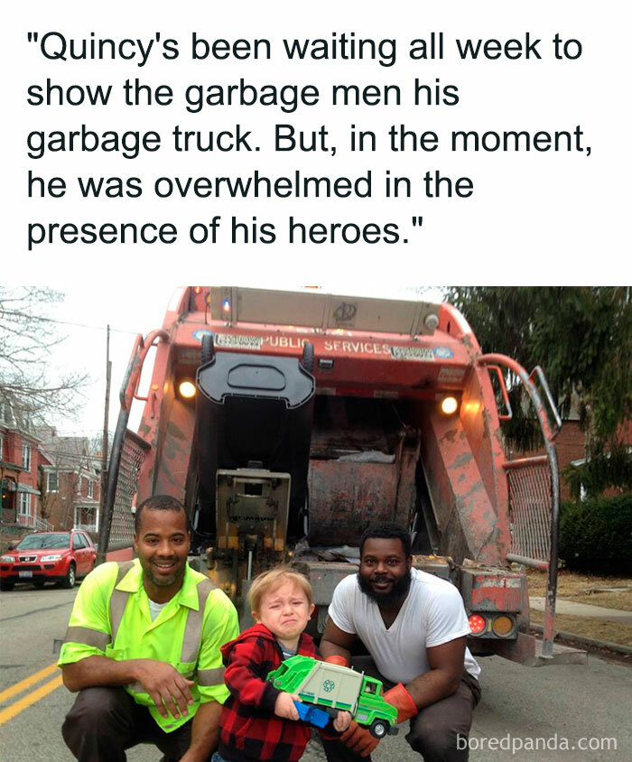 A Waiting meme showing a young boy holding a toy garbage truck while standing in front of a real garbage truck, flanked by two smiling garbage men. The boy looks overwhelmed and emotional. The text above reads, "'Quincy's been waiting all week to show the garbage men his garbage truck. But, in the moment, he was overwhelmed in the presence of his heroes.'" The meme captures the anticipation and excitement of waiting for a special moment, only to be overcome with emotion when it finally arrives.