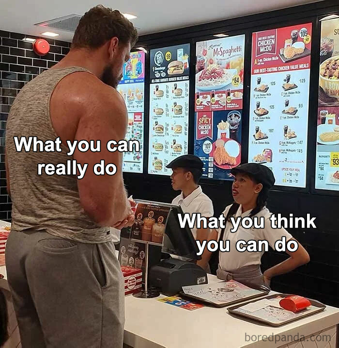 A "You can do it" meme featuring a large, muscular man standing at a fast-food counter, speaking to a cashier who appears much smaller in comparison. The text over the muscular man reads, "What you can really do," while the text over the cashier reads, "What you think you can do." The meme humorously contrasts the difference between one's true potential and the self-doubt or underestimation they might feel, encouraging the viewer to recognize their true capabilities.