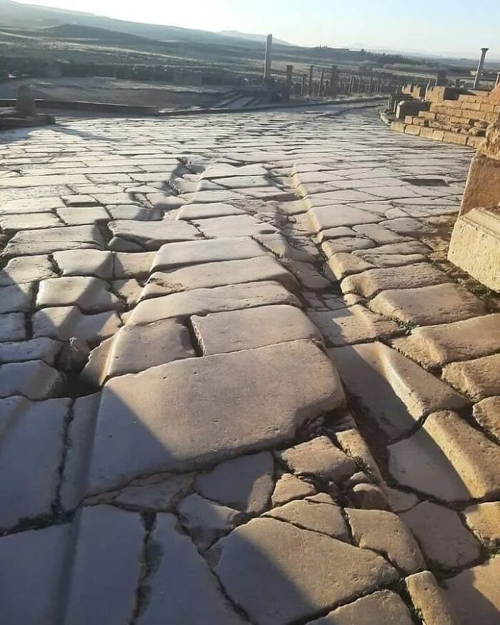 One Of The Most Fascinating Aspects Of Timgad Is The Visible Tracks Left By Roman Chariots. These Grooves, Worn Into The Stone Streets Over Centuries Of Use, Provide Tangible Evidence Of The City’s Vibrant Past