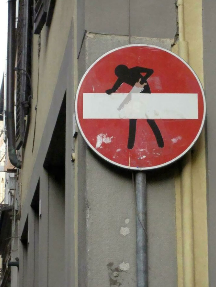 This Stop Sign In Rome Has A Stick Figure Sawing The Hyphen