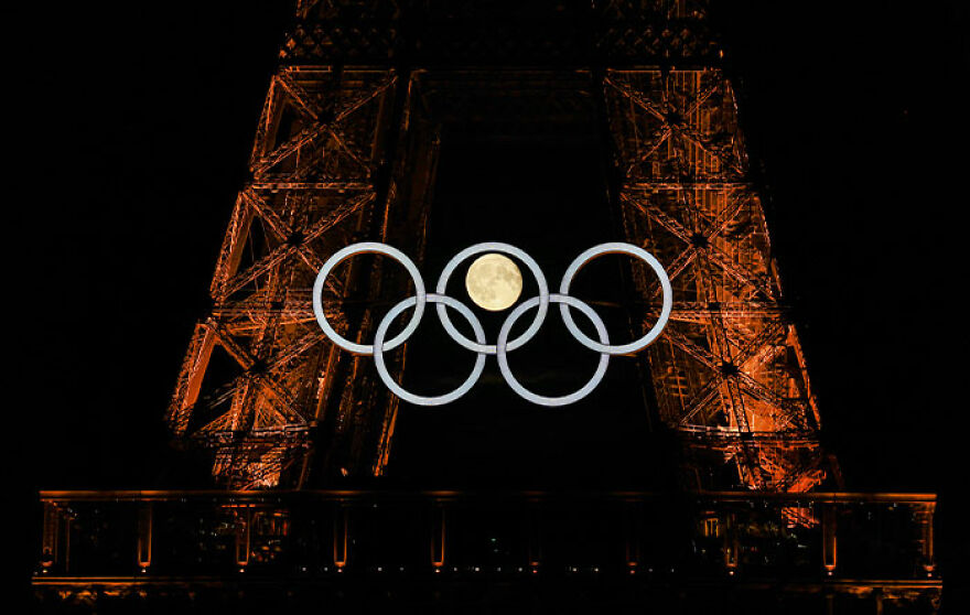 The Moon Appears To Be Nestled Inside The Olympic Rings In Perfect Photo Now Displayed At The Louvre