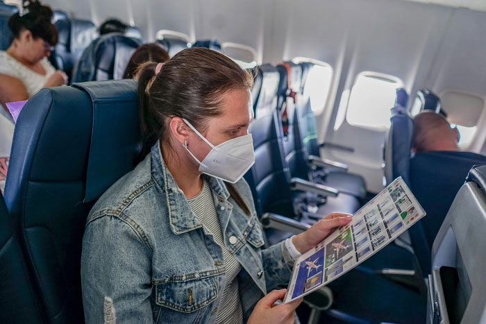 Lady Sandwiched Between Couple On Long Flight Has To Endure Woman’s Obnoxious Behavior For 5 Hours