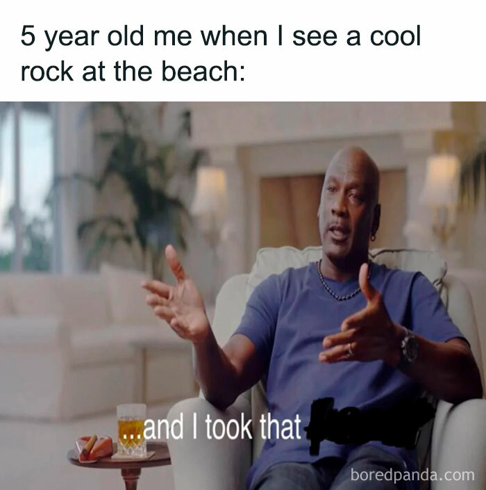 A The Rock meme featuring an image of Michael Jordan sitting in an interview, gesturing with his hands. The text above reads, "5 year old me when I see a cool rock at the beach," followed by the caption, "...and I took that," humorously implying that, like The Rock's namesake, kids can't resist picking up interesting rocks. The meme combines Jordan’s famous line with the playful notion of collecting rocks, playing on the double meaning of “The Rock.”