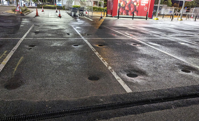 During The Rain You Can See Where The Tires Typically Are At This Car Park