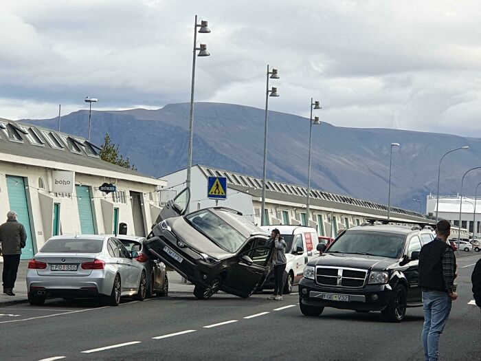 Tourists In Iceland. 50 Meters From The Car Rental