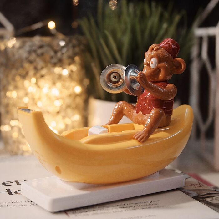 This Clapping Monkey Tape Dispenser Will Make Your Coworkers Go Bananas 