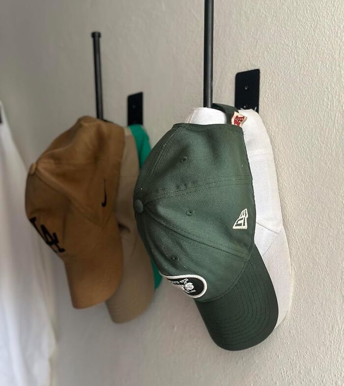 Cap-Tain Your Hat Collection And Avoid The Dreaded "Hatalanche" With This Space-Saving Hat Rack