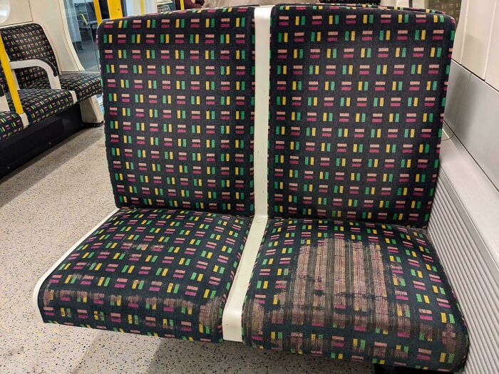 The Inner Seat On This London Underground Train Is Much More Worn Than The Outer One