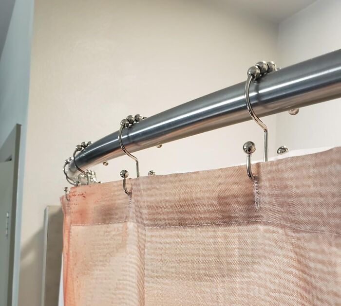 These Shower Curtain Hooks Roll So Smoothly, You'll Feel Like You're Gliding Into A Spa Every Morning 