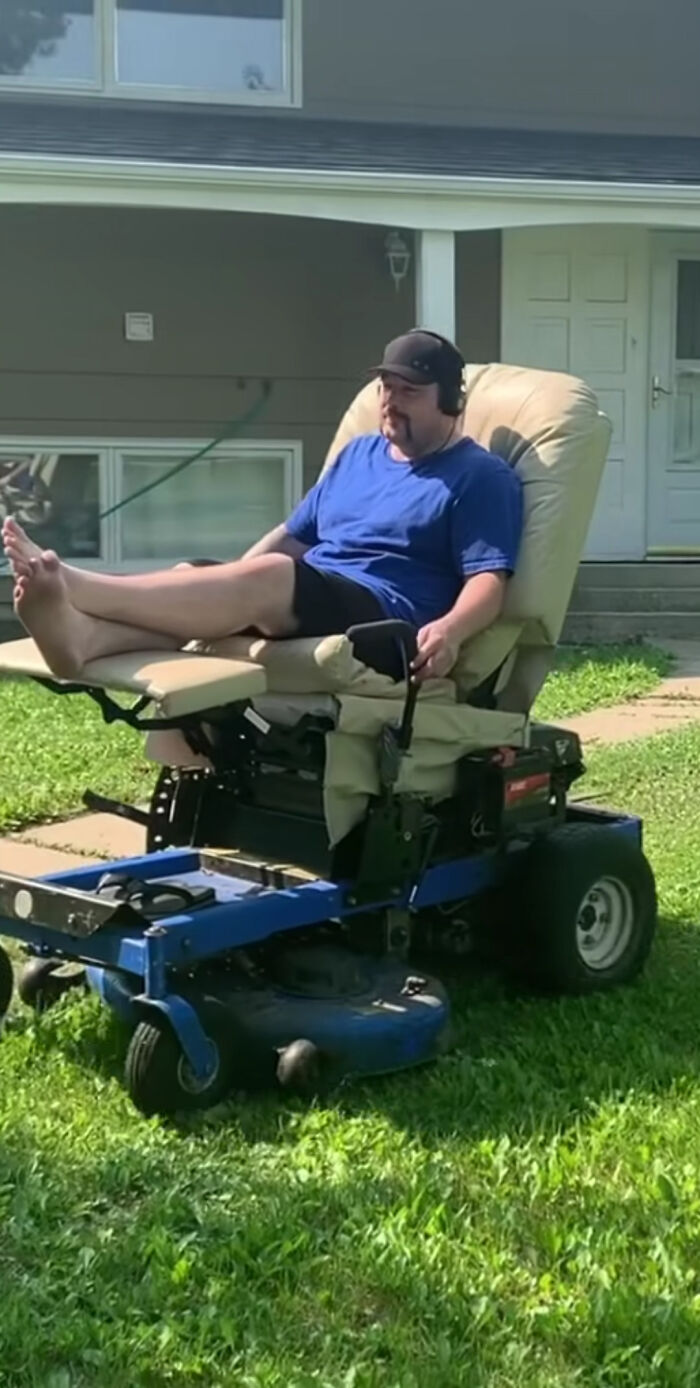 Guy Just Chilling On His Multi-Function Armchair Lawnmower, Listening A Livestock Auction. Allegedly Fitted With Cigarette Lighter, Carry-On Bag Of Tools, Chilled Cupholder, Barbecue Sauce Serving Device And Revolver Holster