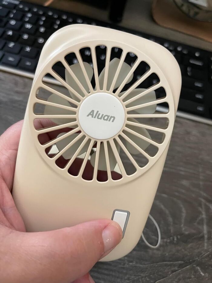 This Mini Fan Is So Compact, You Can Carry It In Your Purse (Or Your Pocket!) For A Refreshing Breeze On The Go