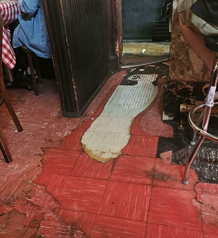 The Multiple Layers Of Floor Worn Through In The Service Bar At This Restaurant