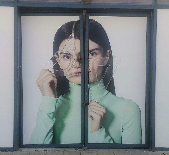 Funny ad fail with a woman's face split awkwardly between two glass doors.