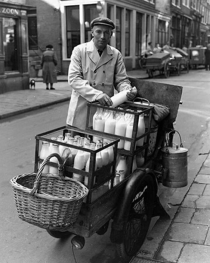 In Amsterdam, Holland, In 1953, A Milkman Was Seen Peddling His Dairy Products, Providing Fresh Milk And Other Essentials To The Community