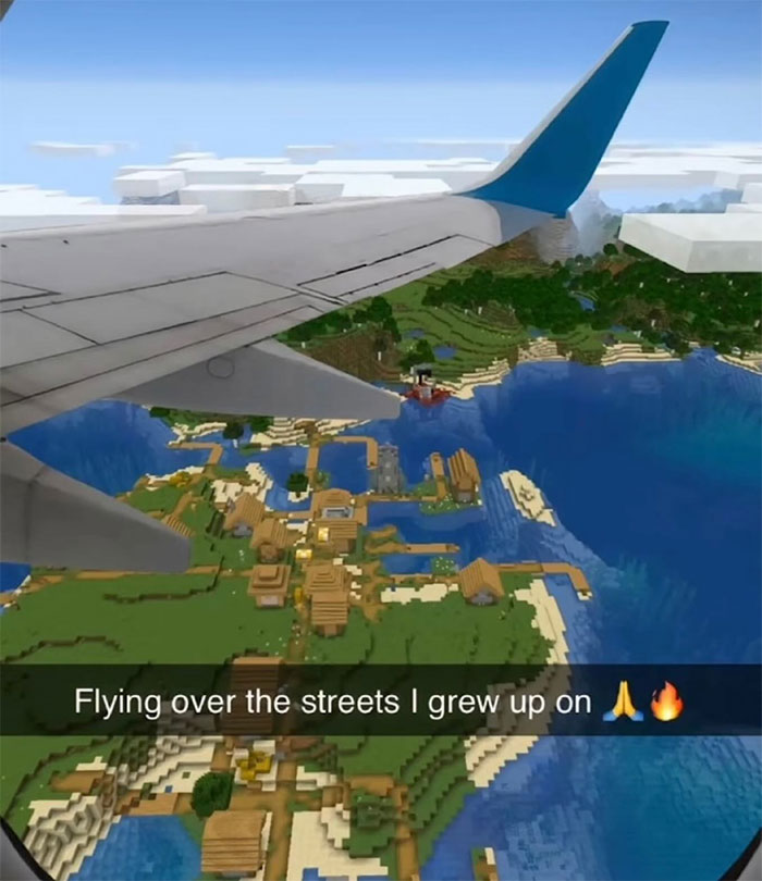 A Minecraft meme featuring a photo taken from an airplane window showing a Minecraft world below, with blocky terrain, buildings, and water. The plane's wing is visible in the foreground, blending a real-life view with the game’s pixelated graphics. The text at the bottom reads, "Flying over the streets I grew up on 🙏🔥," humorously suggesting that the person grew up in a Minecraft world.