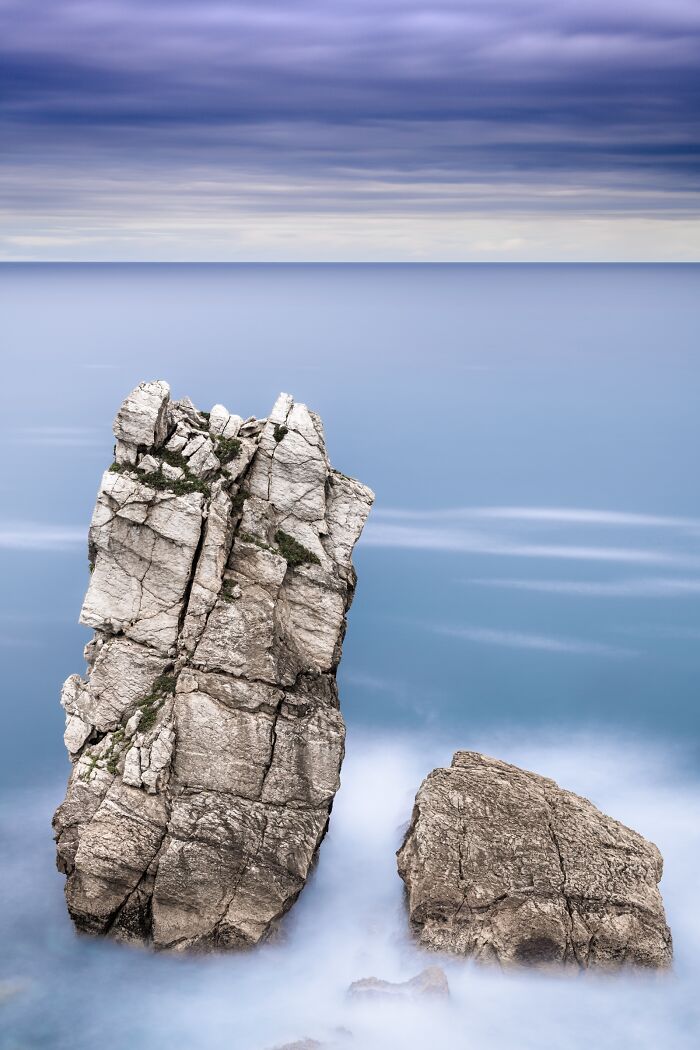 Winning photograph of sea stacks with misty water at Tokyo International Foto Awards 2023.