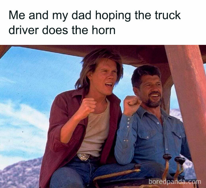 A Dad meme showing a nostalgic moment shared between a father and son. The text reads, "Me and my dad hoping the truck driver does the horn." Below the text is an image of two men sitting together, both excitedly pumping their fists in the air, reminiscent of a universal childhood experience where kids signal truck drivers to honk their horns. The image captures the joy and bonding over a simple, fun moment shared with dad.