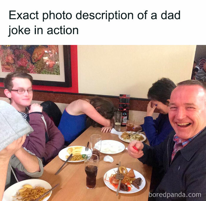 A Dad meme with the caption, "Exact photo description of a dad joke in action." Below the text, there is a photo of a family sitting around a table in a restaurant. The dad, smiling broadly and holding something, looks pleased with himself, while the rest of the family, including a young boy and two girls, are visibly embarrassed or facepalming in response to his joke. The meme humorously captures the classic scenario where a dad proudly tells a corny joke, leaving the rest of the family cringing or laughing awkwardly.