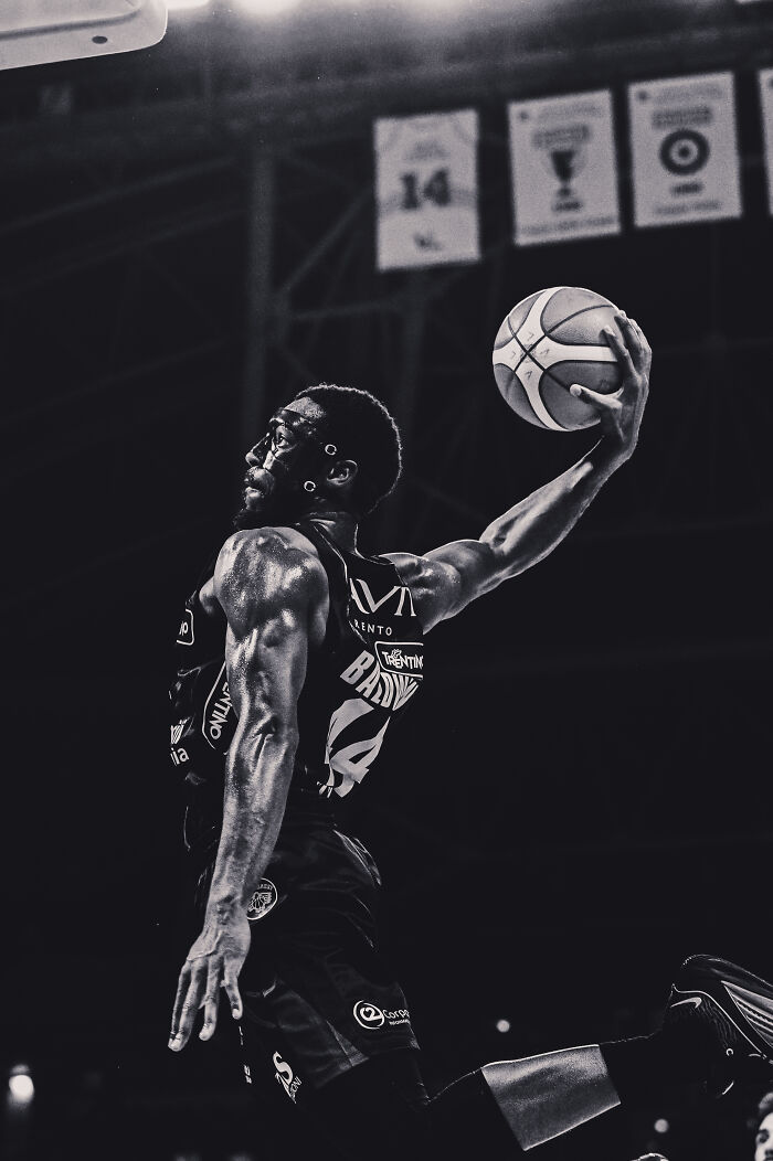 Dynamic basketball player in action, soaring mid-air, showcasing the future of photography.