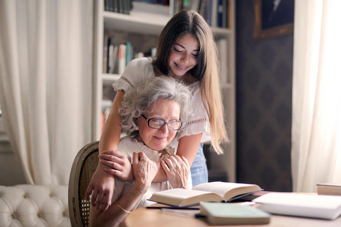 Grandmother and granddaughter sharing a loving moment, highlighting their special relationship at home.