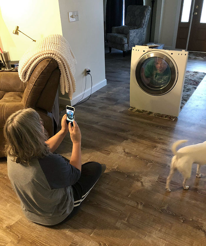 This Is What True Love Looks Like. My Mom Taking A Picture Of My Dad Acting Like He’s Stuck In The Dryer