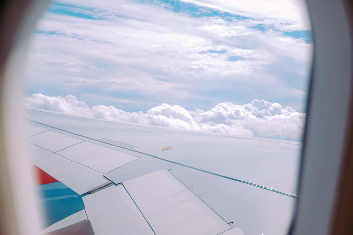 Woman Gets A Window Seat, But Doesn't Get To Enjoy It As A Man Keeps Invading Her Personal Space 