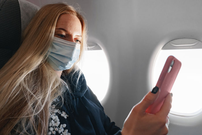 Woman Gets A Window Seat, But Doesn't Get To Enjoy It As A Man Keeps Invading Her Personal Space 