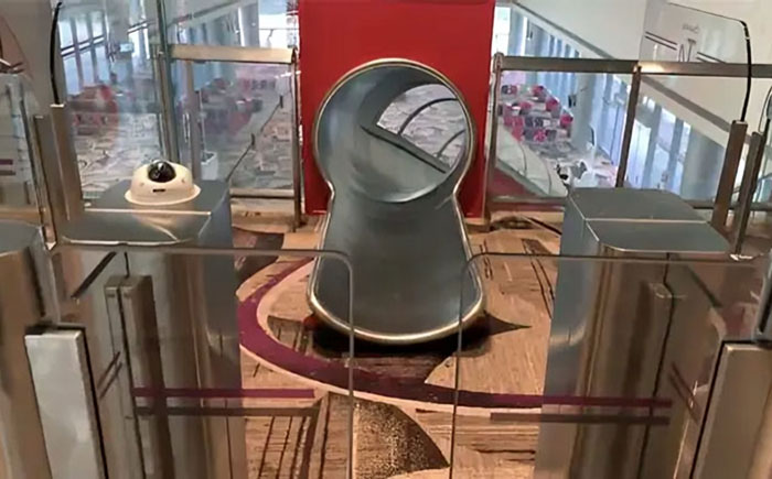 Singapore Airport Allows Passengers To Slide Down To The Terminal Gate