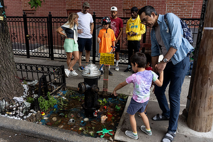 Aquarium With Real Fish Created Around Fire Hydrant "Puddle" Draws Criticism For Its Cruelty