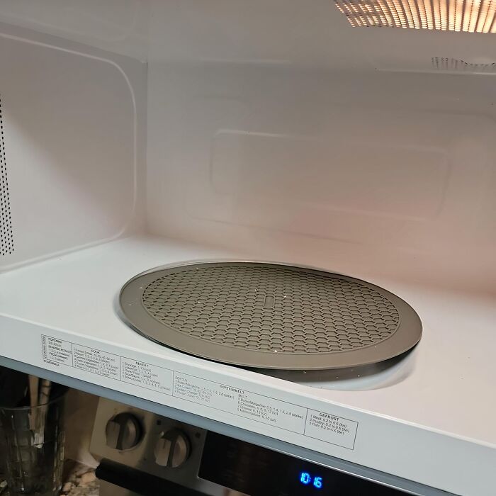  This Compact Microwave Multi-Mat Makes Quick Work Of Any Microwave Spills And Even Doubles As A Pot Holder To Remove Hot Bowls