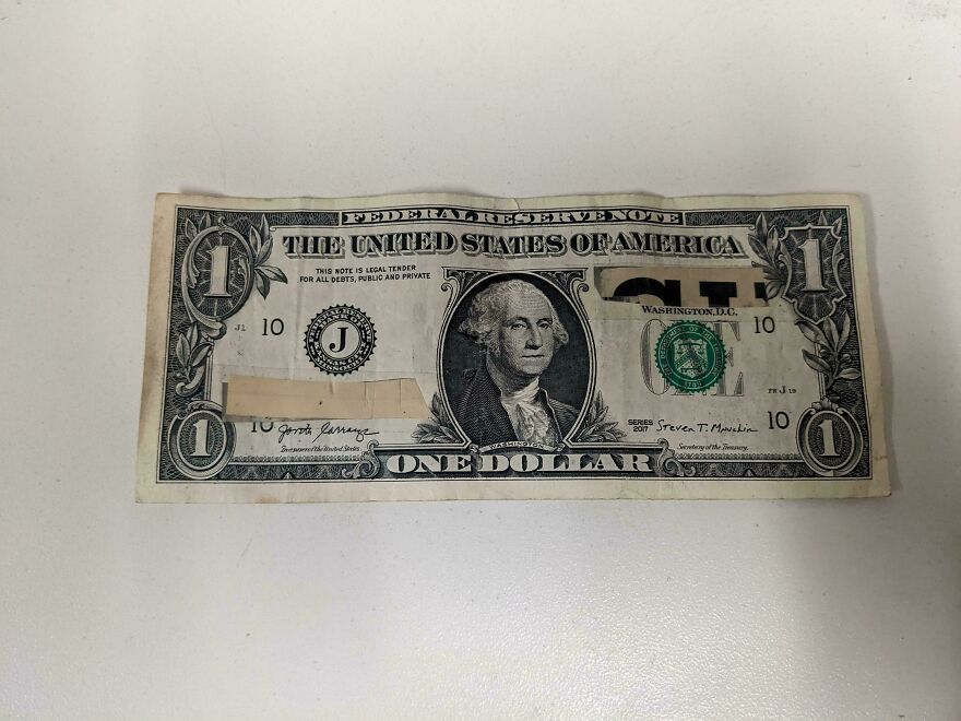 A Customer Paid With A Dollar That Had The Serial Numbers Cut Out Of It