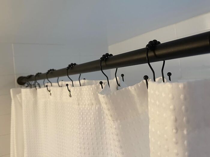  These Shower Curtain Hooks Have Hooks For Both Inner And Outer Curtains, Making Your Shower Time Much Less Of A Hassle