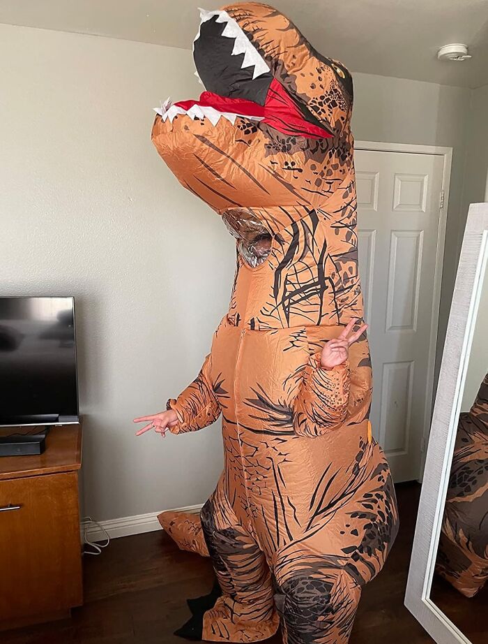  While Everyone Is Dressed As A Sexy Nurse Or Bunny, Live Your Best Life As A Wacky Dinosaur In This Inflatable T-Rex Costume 