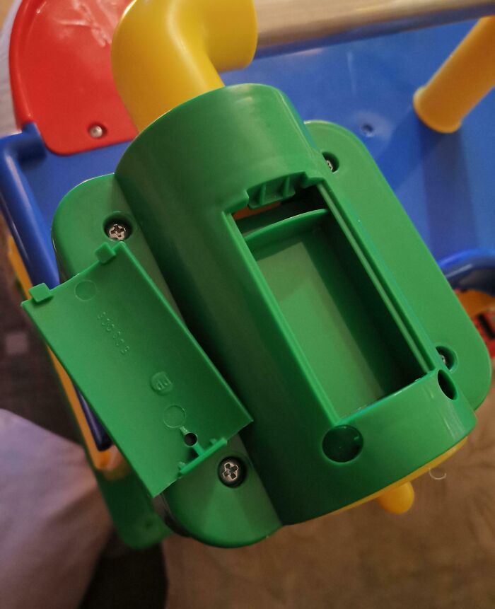 This Toy Parking Deck Has A Battery Compartment Without A Battery Compartment