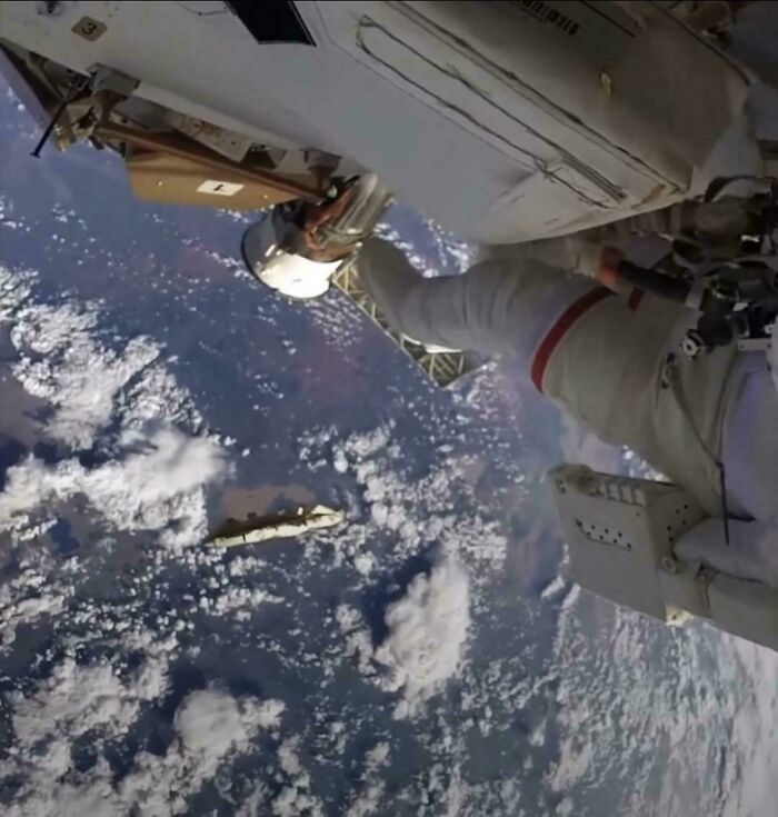 Astronaut outside spacecraft in space, with Earth in the background, highlighting an expensive incident.