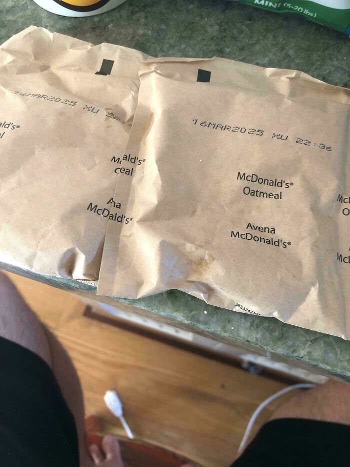 Mildly interesting McDonald's oatmeal packages on a kitchen counter, with expiration date printed on each.