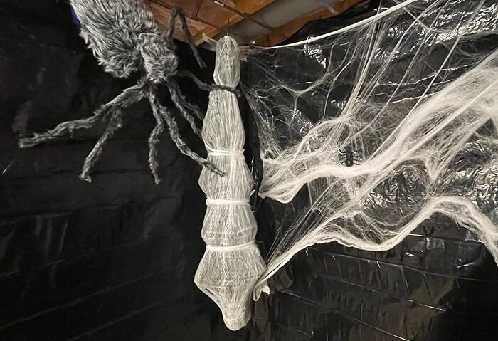 This Hanging Cocoon Corpse Spins A Web Of Terror, Suspending A Mummified Victim In Mid-Air For A Ghastly, Gut-Wrenching Effect That'll Leave Trick-Or-Treaters Screaming... With Delight!