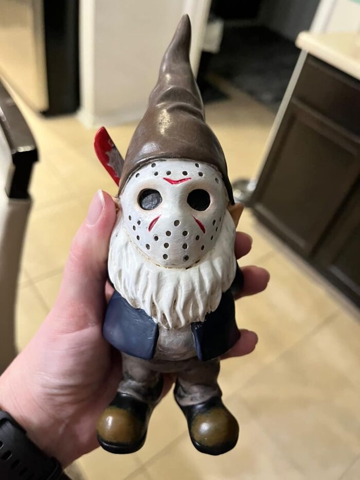 Murder On The Lawn! The Jason Voorhees Garden Gnome Brings A Machete-Wielding Twist To Garden Decor, Because Nothing Says "Welcome To My Yard" Like A Legendary Horror Villain In A Pointy Red Hat!