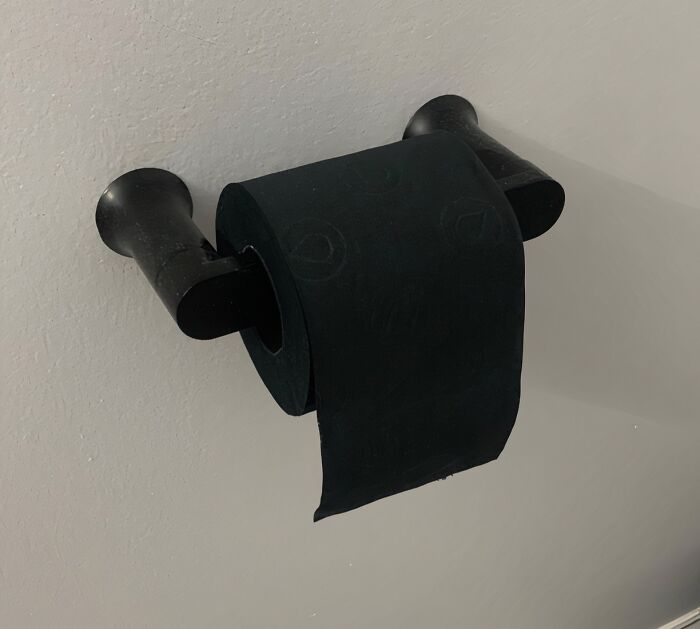 Embrace Your Dark Side And Confuse Your Houseguests With This Inexplicably Goth Black Toilet Paper That's As Mysterious As It Is Impractical