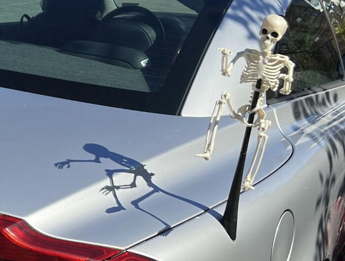 Your Car's Antenna Just Got A Grave New Friend With This Tiny Skelleton Hanging On For Dear Life