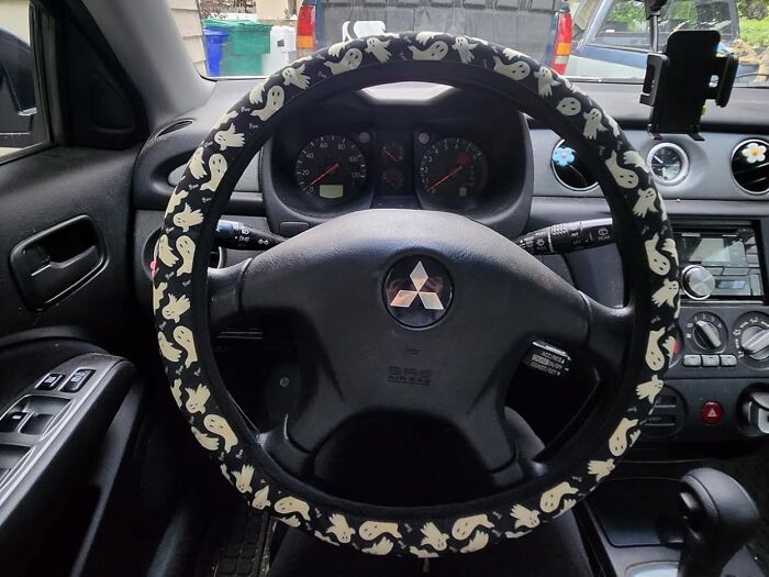 Get A Grip On The Spooky Season With This Ghostly Grip Steering Wheel Cover That's Sure To Possess Your Ride With Some Eerie Style