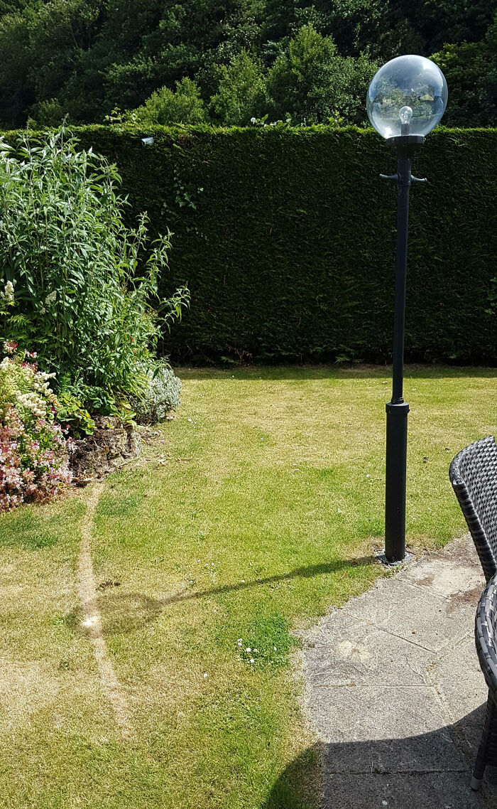 The Glass Globe Of This Light Focused The Sunlight Enough To Burn The Sun's Path Into The Grass