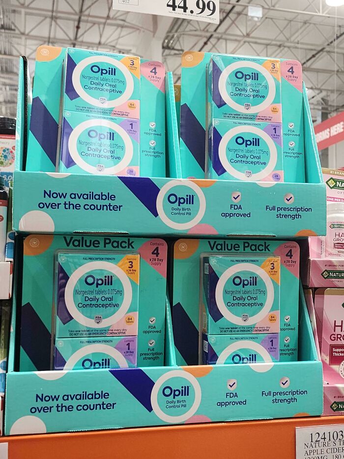 Display of Opill daily oral contraceptive packs in a store, newly available over the counter.