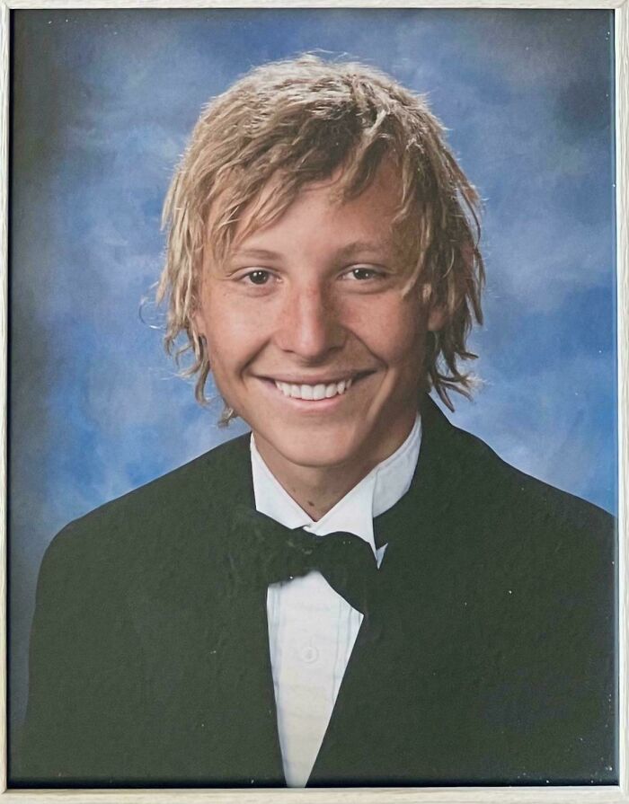 Person in formal attire with tousled hair, exemplifying a tragic hair accident.