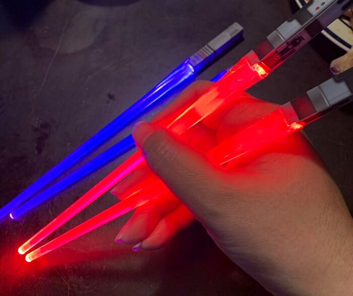 May The Flavor Be With Your Friends With The Lightsaber Chopsticks, A Gift That Brings A Galactic Twist To Dinner Time!