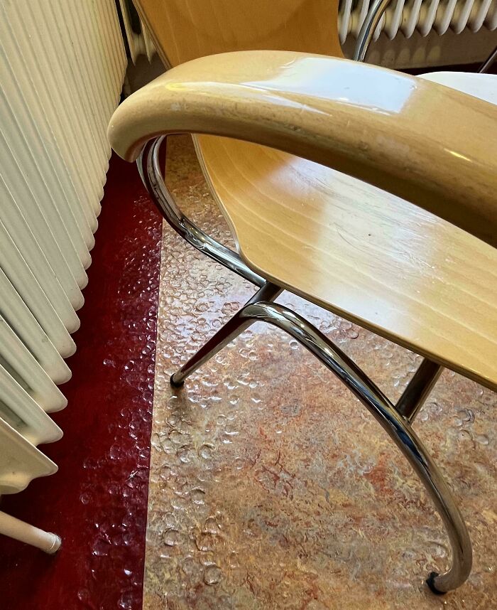 Chair with bubble wrap texture on the floor, adding a mildly interesting detail to the setting.