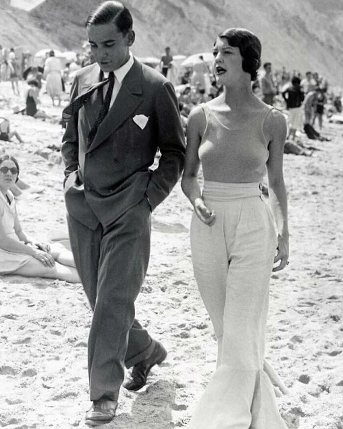 A Dutch Couple Take A Stroll Along The Beach In The 1930s