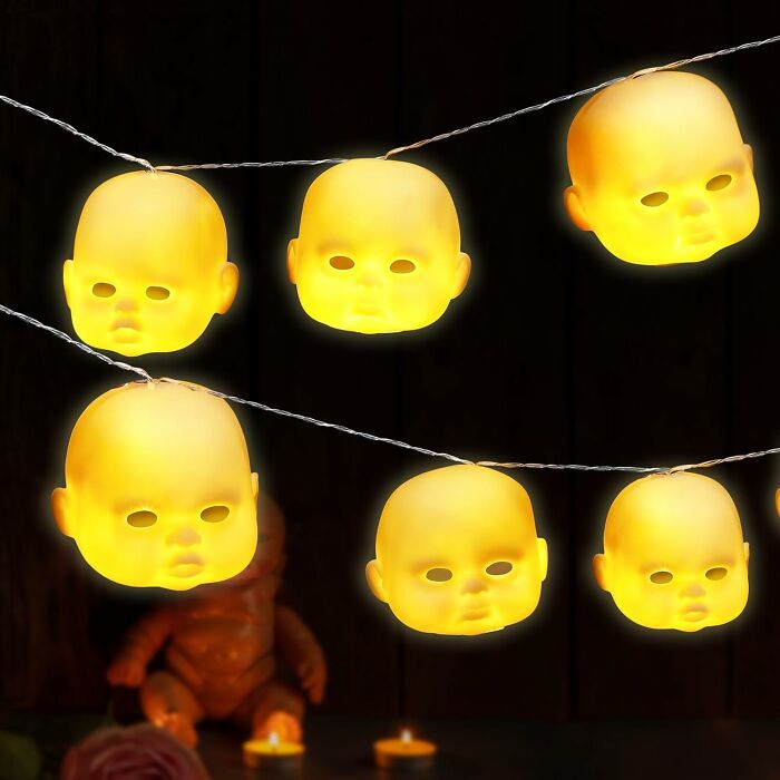 These Creepy Dollhead String Lights Transform A Typically Wholesome Decoration Into A Surreal And Unnerving Spectacle