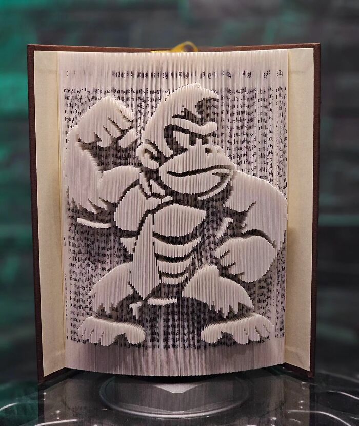 From Pages To Pixels: The Enchanting Sculptures Of Book Master